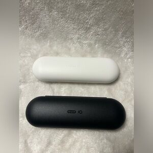 2 white black Oral-B iO plastic electric toothbrush travel case cases